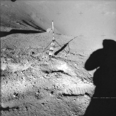 Apollo 70mm Hasselblad image (frame ID AS16-109-17801) showing footprints in lunar regolith, with gnomon for scale.