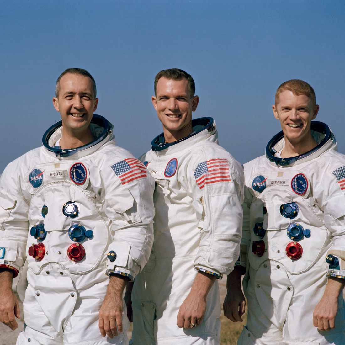 Apollo 9 Crew posing in their space suits.